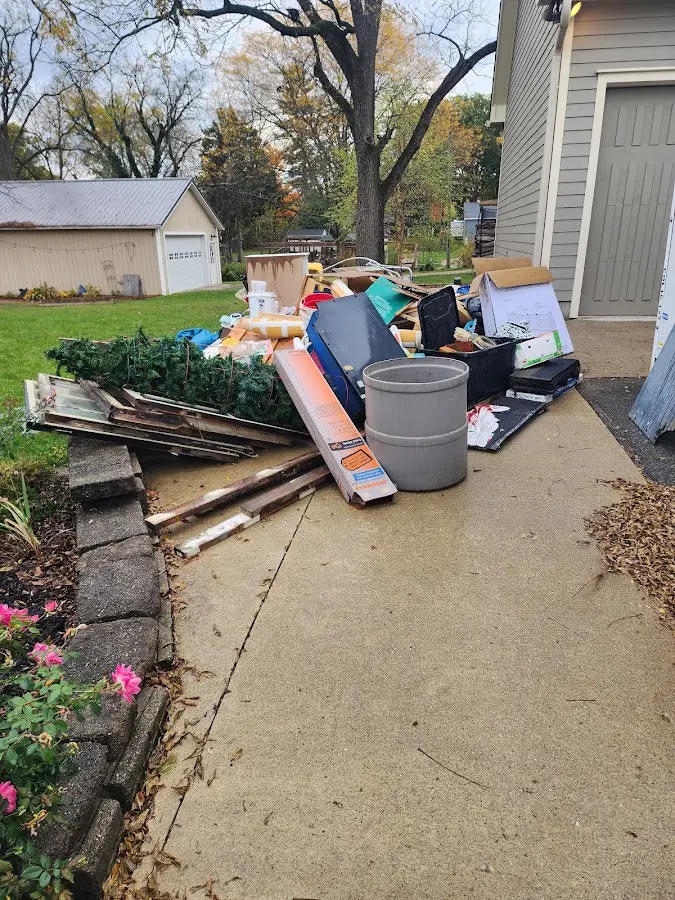 Dumpster being loaded with debris for Roofing Dumpster Rental in La Presa